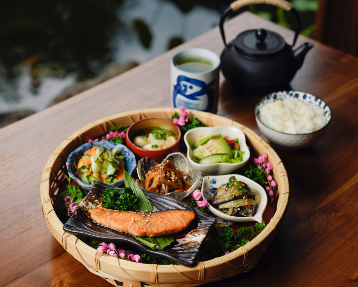 Traditional Japanese meal set with grilled salmon and tea at Dahana Japanese restaurant Bali