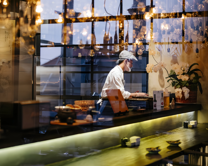 Chef preparing Japanese dishes at Rayjin Teppanyaki restaurant in Bali